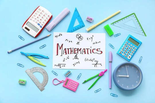 Paper sheet with word MATHEMATICS and school stationery on blue background