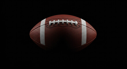 A football is placed on a dark black background.