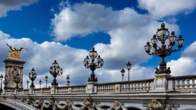 Exploring a beautiful bridge in Paris featuring intricate lamp posts against a backdrop of dynamic clouds