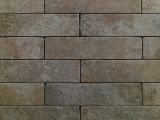 The brick wall is grey. Brick background. The texture of a gray brick.