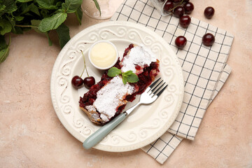Plate with piece of tasty cherry strudel, napkin and fresh berries on pink grunge background