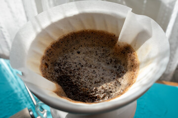 brewing coffee under sunlight in close-up	