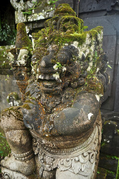 Art sculpture and carved antique deity angel god of hindu statue balinese style in Pura Ulun Danu Bratan or Pura Bratan Hindu Shaivite Shiva temple in Bratan near Bedugul in Bali, Indonesia