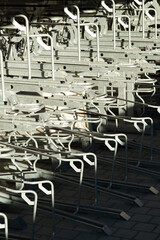 modern bike parking space in close up. empty bike rack with no bicycles. light shadow pattern
