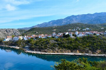 View of Stinica tourist village above the shore of the Adriatic sea and bellow Velebit mountains in...