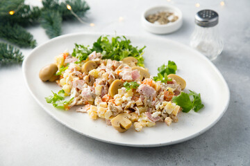 Potato salad with ham and pickled mushrooms