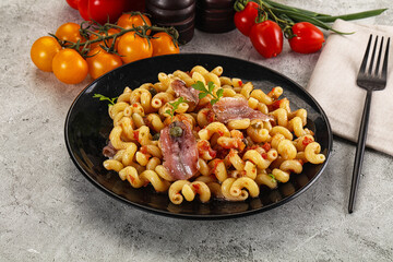 Italian pasta cellentani with anchovy