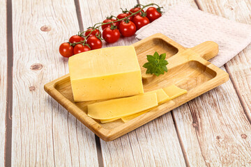 Yellow cheese piece with slices