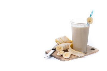 Fresh and healthy banana smoothie in glass isolated on white background. Copy space