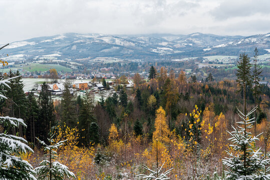 Jablunkov town with hills of Moravskoslezske Beskydy mountains on the background during early winter