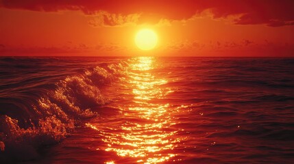 A breathtaking sunset over tranquil ocean waves with vibrant hues of orange and gold reflecting on the water's surface