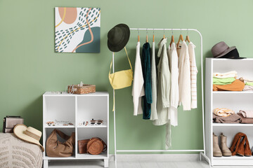 Stylish interior of dressing room with female clothes, shoes and accessories