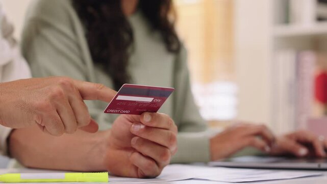 Couple using tablet and credit card to shop online through e-commerce app, making payment and browsing modern platform with promo codes and discount offers