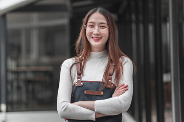Empowered young woman smiling, urban cityscape, portrait, modern environment, eye-level view