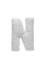 Handmade crocheted letter N in light grey yarn, isolated on white back