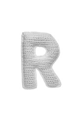 Handmade crocheted letter R in light grey yarn, isolated on white back