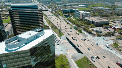 Rooftop view modern glass office buildings, corporate office headquarters in Westchase business...