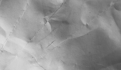 Textured grey paper, aged and recycled, for background designs.