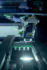 Circuit board moving through assembly line. Electronics component installation, CMD. Automated