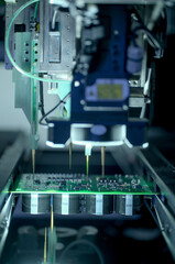 Circuit board moving through assembly line. Electronics component installation, CMD. Automated