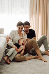 Happy family tickling and having fun at home