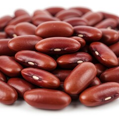 A close up view of a pile of red kidney beans with white background in a studio shot image