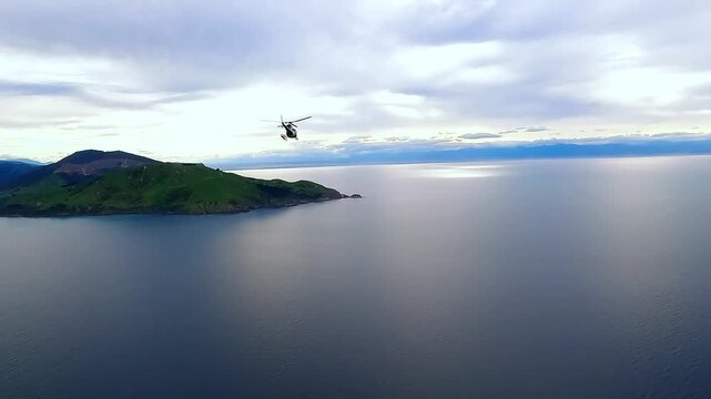 Helicopter flying past Pepin Island, Nelson, New Zealand