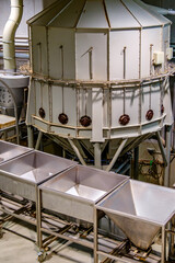 Coffee roasting equipment in action at a local roastery showcasing the intricacies of the roasting process during a busy afternoon