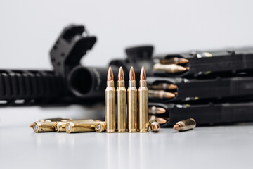 Close-up of rifle with ammunition on white background. Concept of armed forces and arms sales.