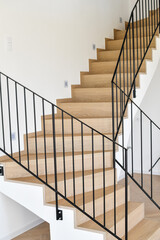 Wooden staircase in a new modern house, close up.