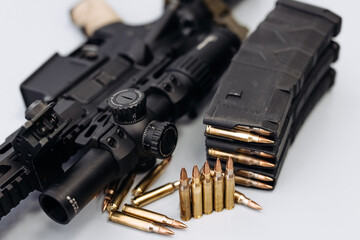 Ammunition with automatic rifle on white isolated background. Concept of varieties of firearms and armed forces.
