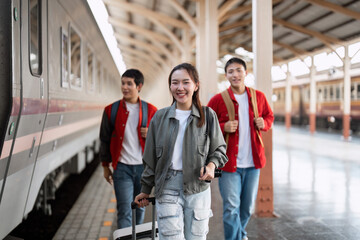 Travel and Adventure. A trio of friends enjoying their journey at a bustling train station.
