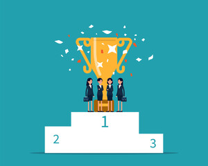 Business team with winning trophy on first place podium
