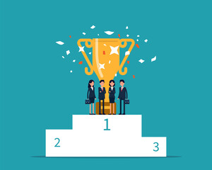 Business team with winning trophy on first place podium
