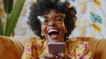 Happy mature old 60s woman holding smartphone using mobile phone app for video call, laughing while watching funny video, feeling excited winning online lottery bid on cellphone sits on couch at home
