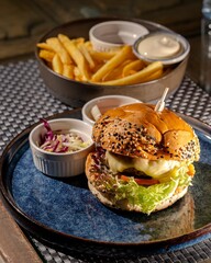 Delicious burger and crispy fries cozy restaurant setting food photography warm lighting close-up view culinary delight