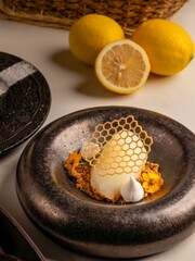 Delicious lemon dessert presentation culinary event fine dining restaurant elegant atmosphere close-up view gastronomic delight