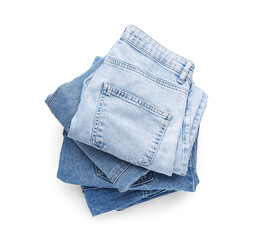 Stack of clean folded jeans pants isolated on white background