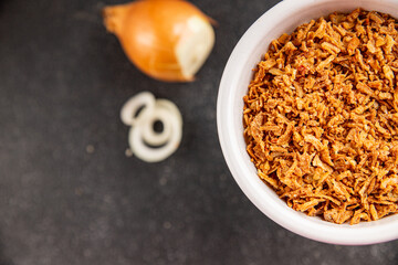 Fried onion crispy onions appetizer vegetables dish fresh delicious gourmet food background on table rustic food top view copy space vegetarian and vegan food