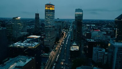 Milwaukee skyline at dusk, s and p 500 index displayed on northwestern mutual tower