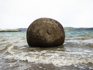 Koutu Boulders spherical round shape stone rock formation cement concretion geological phenomenon Hokianga Harbour beach Opononi Northland New Zealand