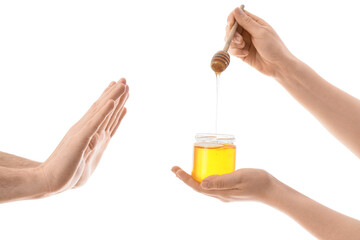 Man rejecting female hands with honey on white background. Food Allergy Awareness Month