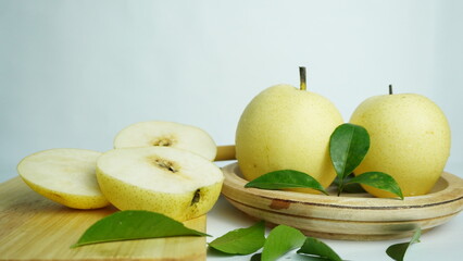 pears on a wooden tray white background