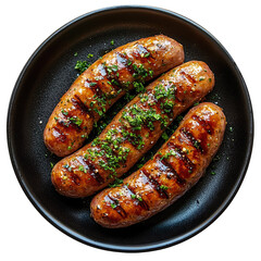 Top view of a delicious looking Möhrenpüree mit Bratwurst on a dark plate isolated on a white transparent background.
