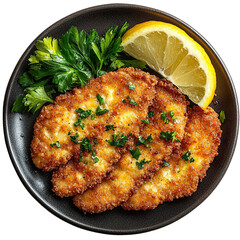 Top view of a delicious looking Schnitzel Holstein on a dark plate isolated on a white transparent background.
