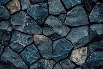Fototapeta premium Black stone wall texture ideal for interior design or wallpaper. Dark rock surface in a dimly lit room, featuring 2/3 space for text overlay. Perfect for modern aesthetics.