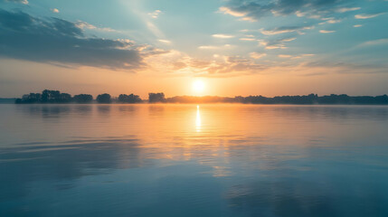Fototapeta premium Majestic sunrise with golden light reflected on the serene surface of water