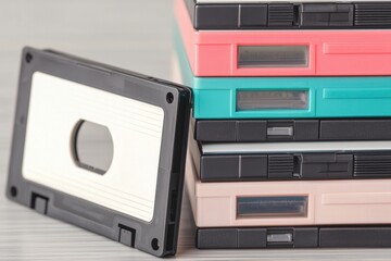 Obraz premium Colorful Vintage Video Cassettes Stacked in a Retro Arrangement