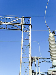 Electrical substation under clear blue sky. Energy production and distribution industry...