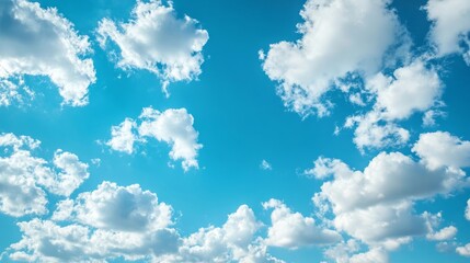 Abstract background blurred fusion minimal. A bright blue sky filled with fluffy white clouds, creating a serene and uplifting atmosphere.